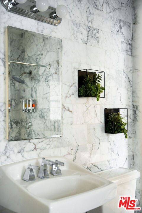 1205 Sanborn Avenue Los Angeles, CA 90029 - Photo 30 of 48 a living room with couches and a flat screen tv