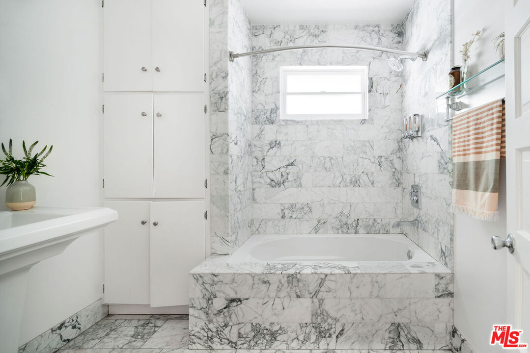 1205 Sanborn Avenue Los Angeles, CA 90029 - Photo 31 of 48 a bathroom with a bathtub and shower