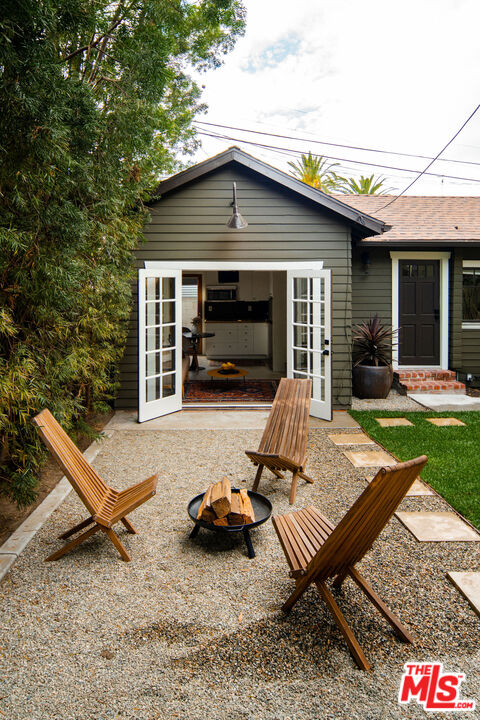 1205 Sanborn Avenue Los Angeles, CA 90029 - Photo 32 of 48 a view of a lounge chair in the front of a house