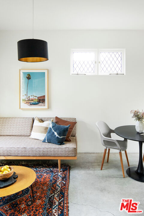 1205 Sanborn Avenue Los Angeles, CA 90029 - Photo 38 of 48 a living room with furniture and a rug