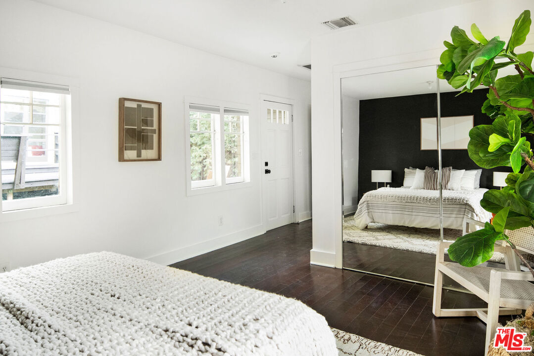 1205 Sanborn Avenue Los Angeles, CA 90029 - Photo 42 of 48 a bedroom with a bed and a potted plant