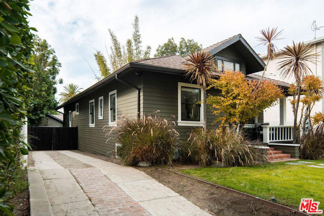 1205 Sanborn Avenue Los Angeles, CA 90029 - Photo 47 of 48 a front view of a house with a garden