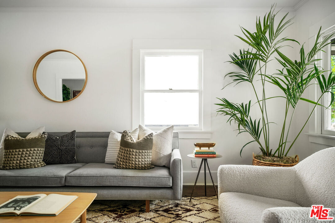1205 Sanborn Avenue Los Angeles, CA 90029 - Photo 9 of 48 a living room with furniture and a large window