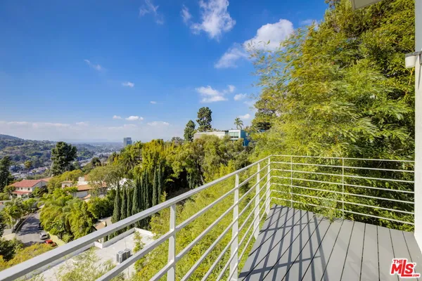 a view of a balcony with sky view