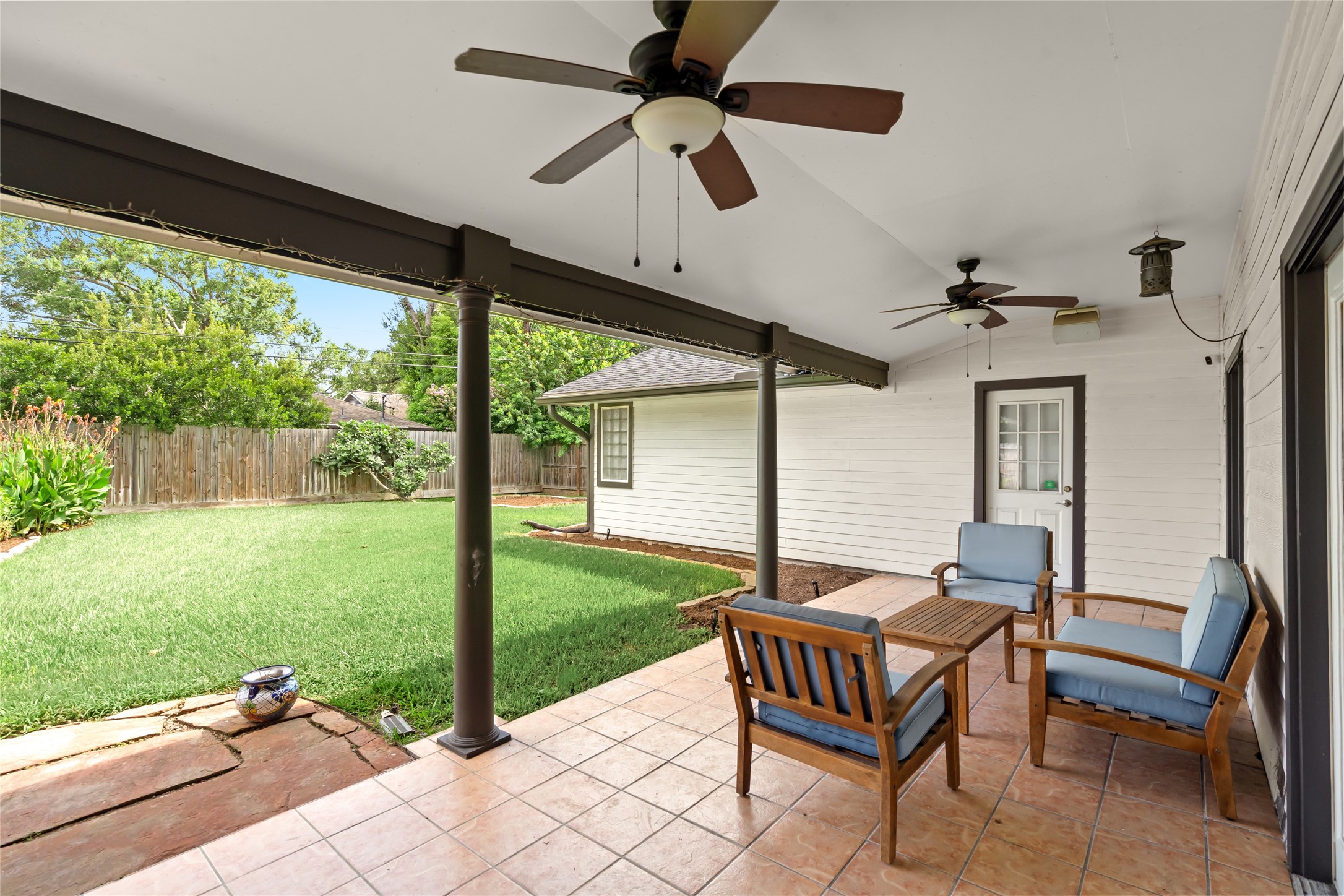 5614 Edith Street Houston, TX 77081 - Photo 15 of 19 Step outside onto the covered patio, perfect for entertaining or simply enjoying the summer months.