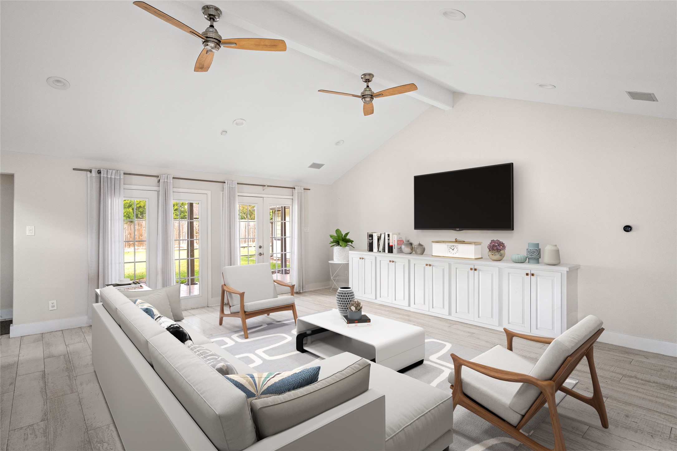 5614 Edith Street Houston, TX 77081 - Photo 3 of 19 The living room has access to the backyard. *Virtual staging has been added*