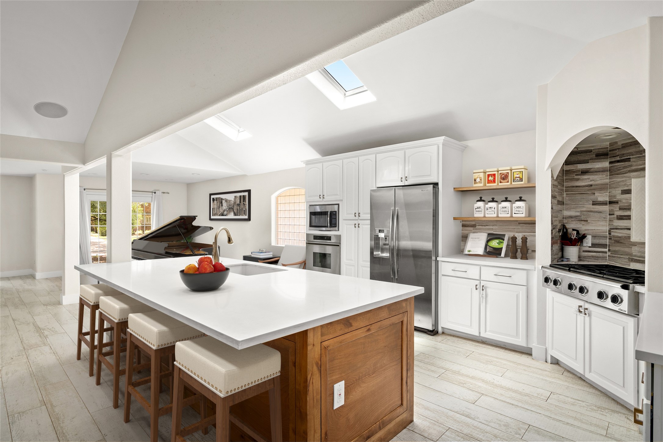 5614 Edith Street Houston, TX 77081 - Photo 4 of 19 The kitchen features two skylights, stainless steel appliances and plenty of storage space. *Virtual staging has been added*