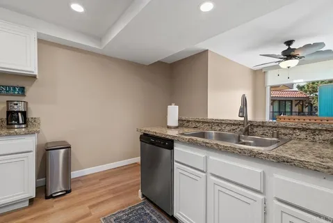 a kitchen with stainless steel appliances a refrigerator stove and microwave