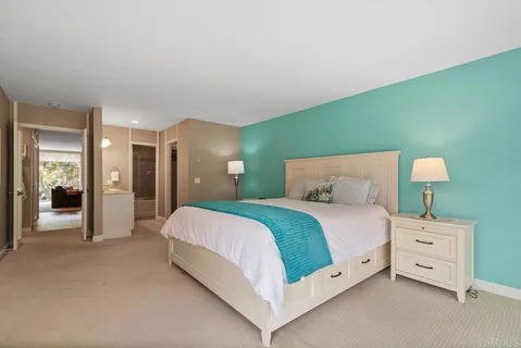 a bedroom with a bed chair and a window