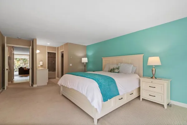 a bedroom with a bed chair and a window