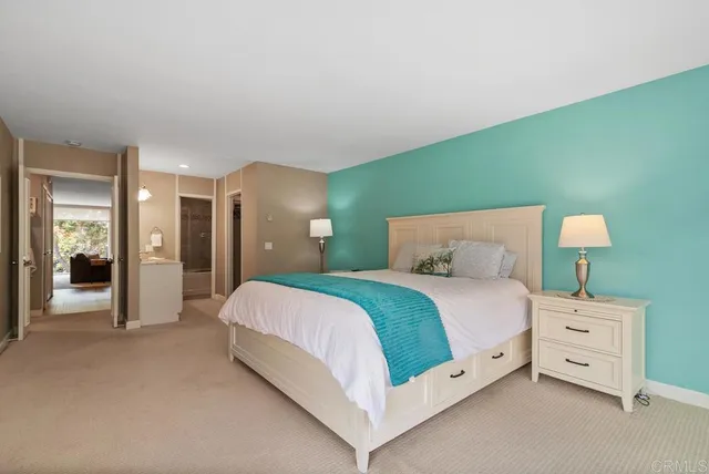 a bedroom with a bed chair and a window