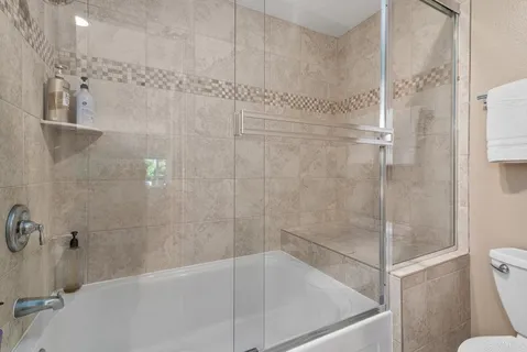 a balcony view with a seating space