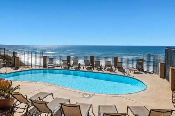 a view of a swimming pool with a lounge chair