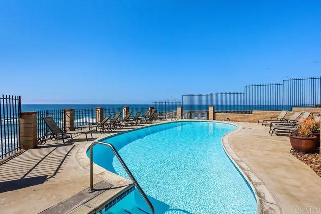a view of swimming pool with outdoor seating
