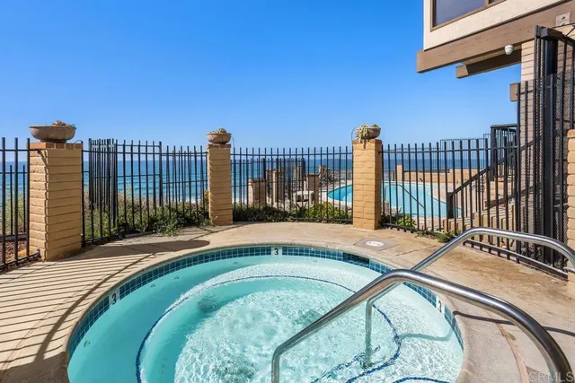 a swimming pool with outdoor seating and yard