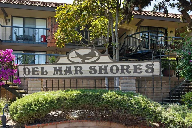 a view of a sign board with a street sign