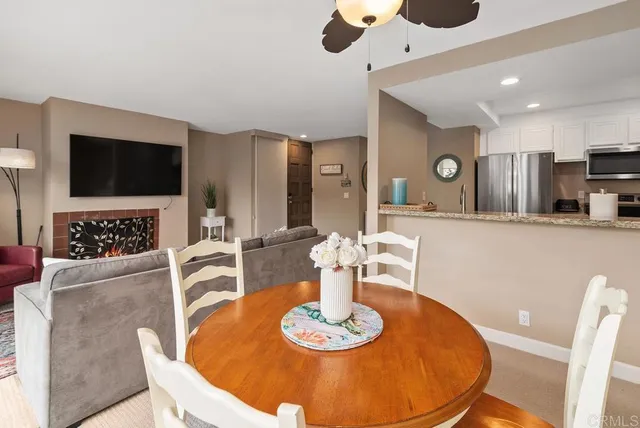 a living room with furniture fireplace and flat screen tv