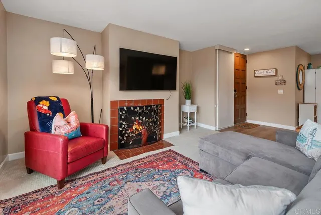a living room with a couch and a chandelier