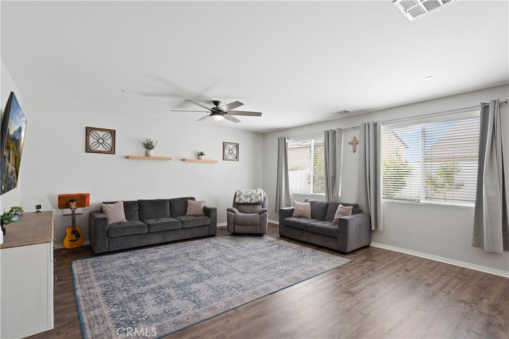 12875 Wainwright Lane Moreno Valley, CA 92555 - Photo 11 of 37 a living room with furniture and a large window