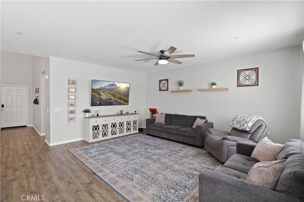 12875 Wainwright Lane Moreno Valley, CA 92555 - Photo 12 of 37 a living room with furniture and a flat screen tv