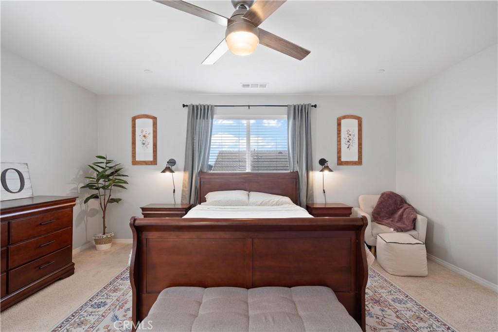 12875 Wainwright Lane Moreno Valley, CA 92555 - Photo 23 of 37 a room with furniture a window and a chandelier