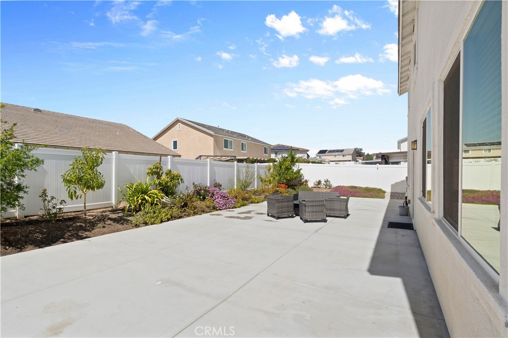 12875 Wainwright Lane Moreno Valley, CA 92555 - Photo 30 of 37 a view of a house with backyard and sitting area
