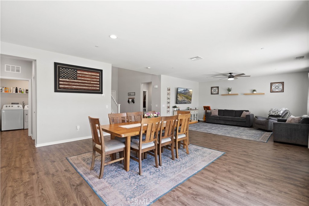 12875 Wainwright Lane Moreno Valley, CA 92555 - Photo 9 of 37 a view of a dining room with furniture wooden floor and next to a window