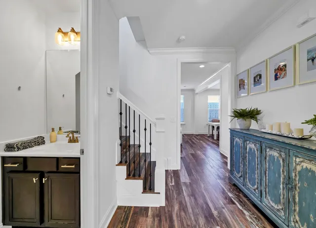 a view of entryway and hall with wooden floor