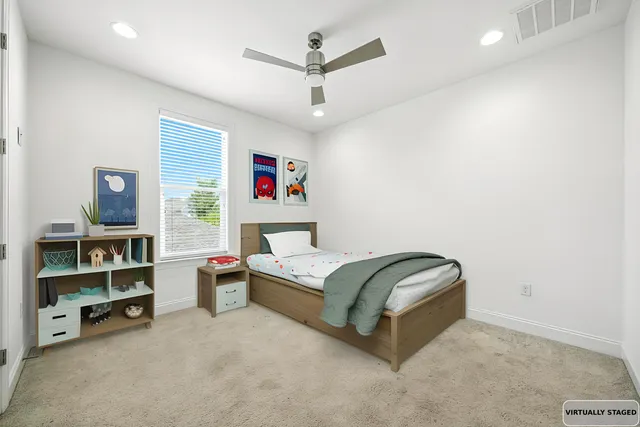 a bedroom with a bed furniture and a window