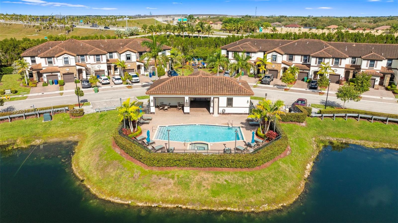 9000 Northwest 183rd Street, Unit 9000 Hialeah, FL 33018 - Photo 11 of 41 a view of a swimming pool with a lake view