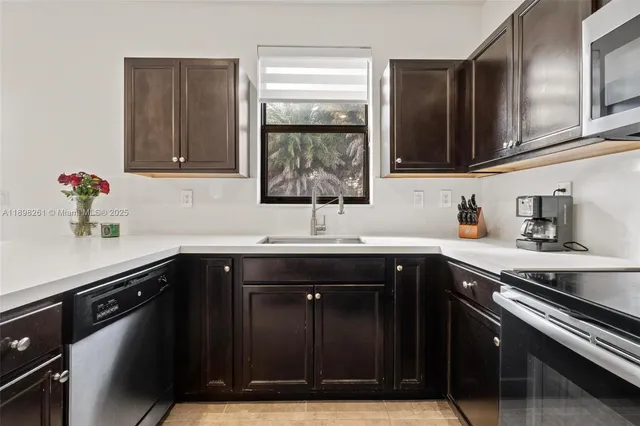 a kitchen with a sink and cabinets