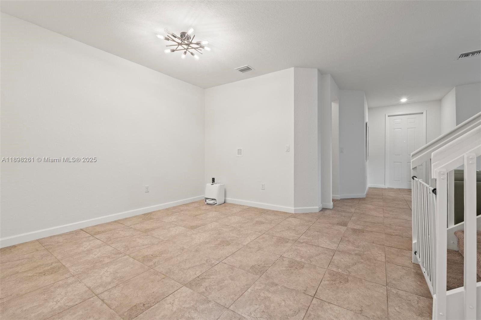 9000 Northwest 183rd Street, Unit 9000 Hialeah, FL 33018 - Photo 23 of 41 a view of an empty room