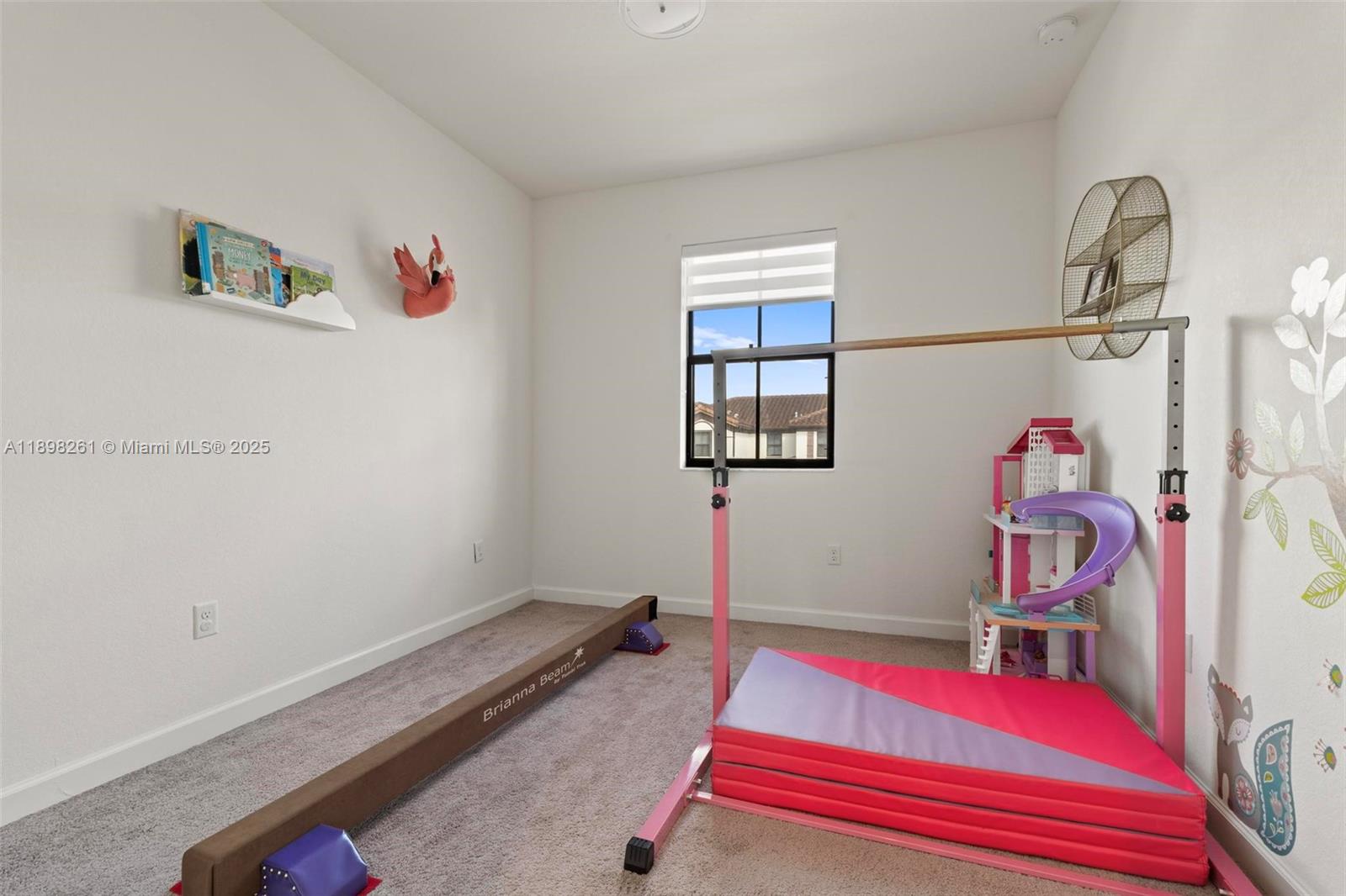 9000 Northwest 183rd Street, Unit 9000 Hialeah, FL 33018 - Photo 37 of 41 a room with gym equipment and a rug