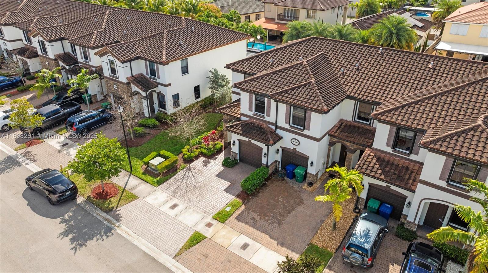9000 Northwest 183rd Street, Unit 9000 Hialeah, FL 33018 - Photo 6 of 41 a aerial view of a house with a yard