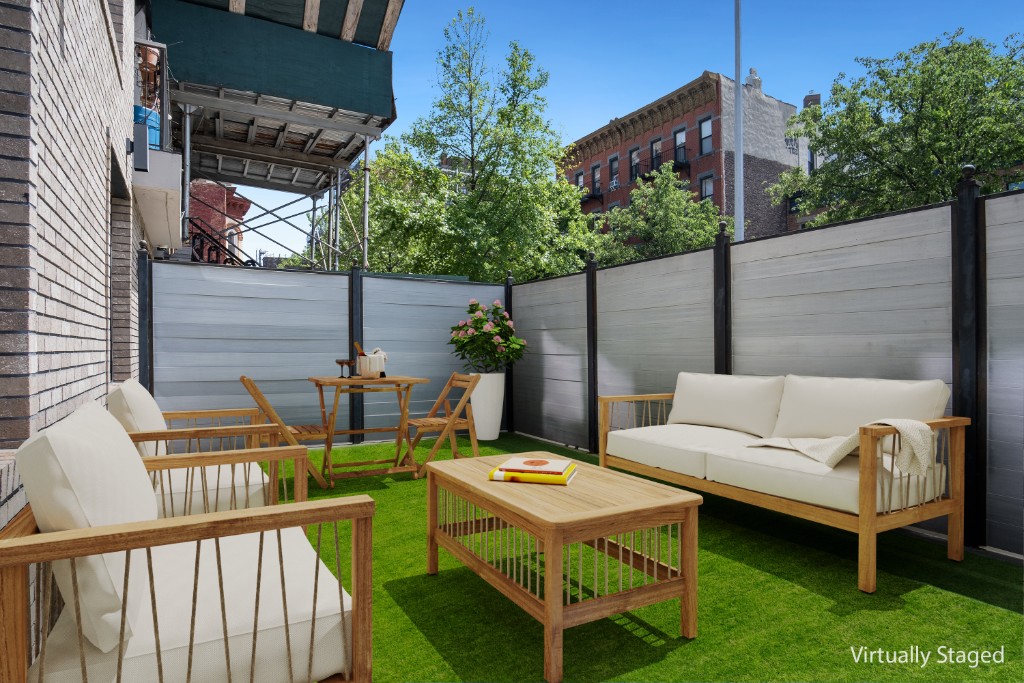 311 Hart Street, Unit 1A Brooklyn, NY 11206 - Photo 4 of 16 a backyard of a house with outdoor seating