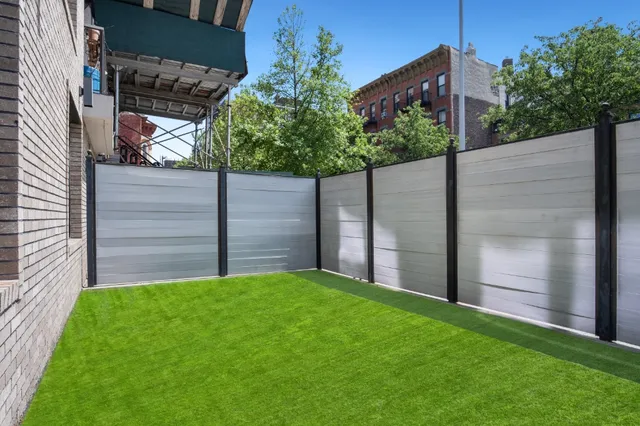 a view of a back yard from a room