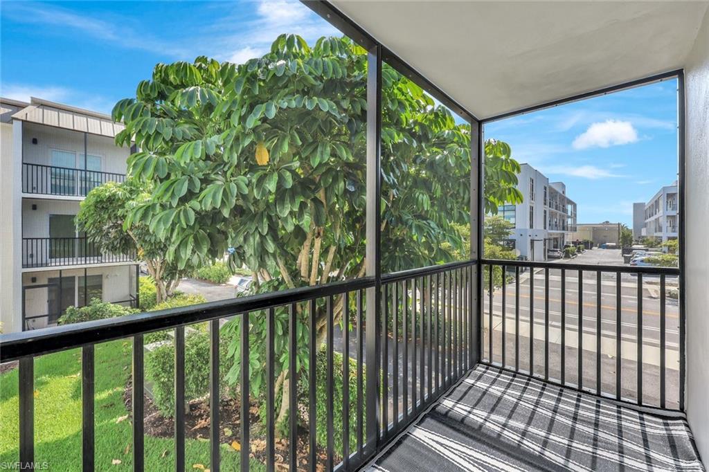 766 Central Avenue, Unit 207 Naples, FL 34102 - Photo 14 of 18 a view of a balcony with a plant