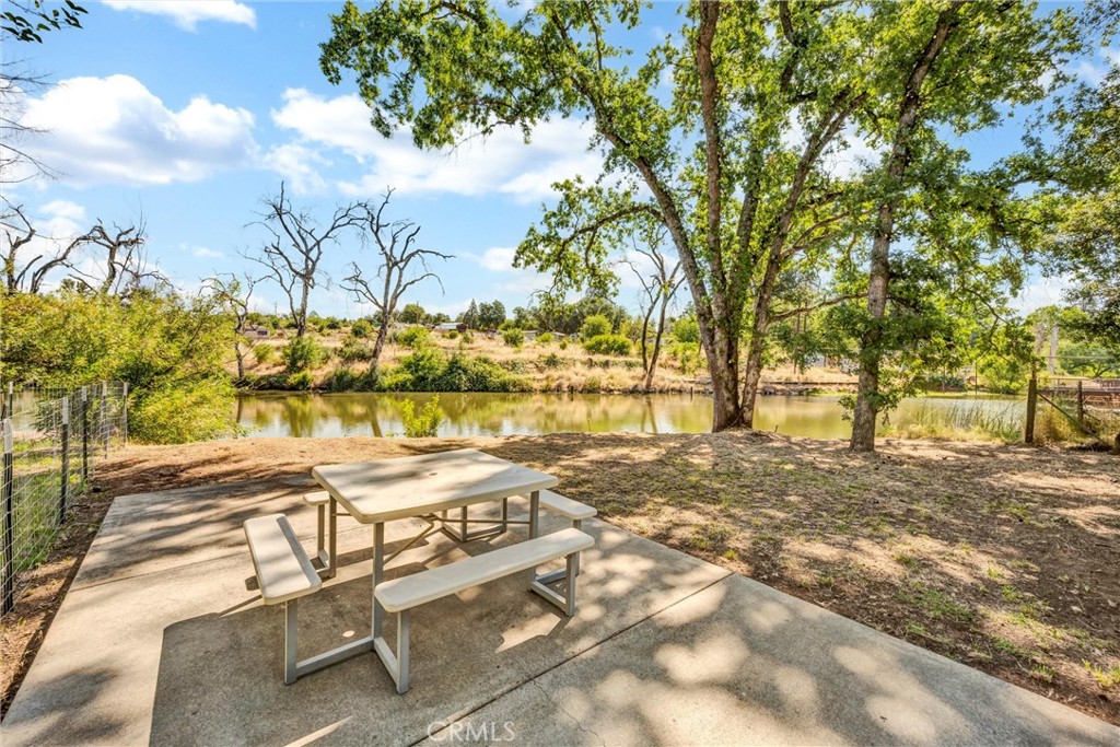 16410 Tish-A-Tang Road Lower Lake, CA 95457 - Photo 41 of 48 a view of patio with table and chairs under an umbrella