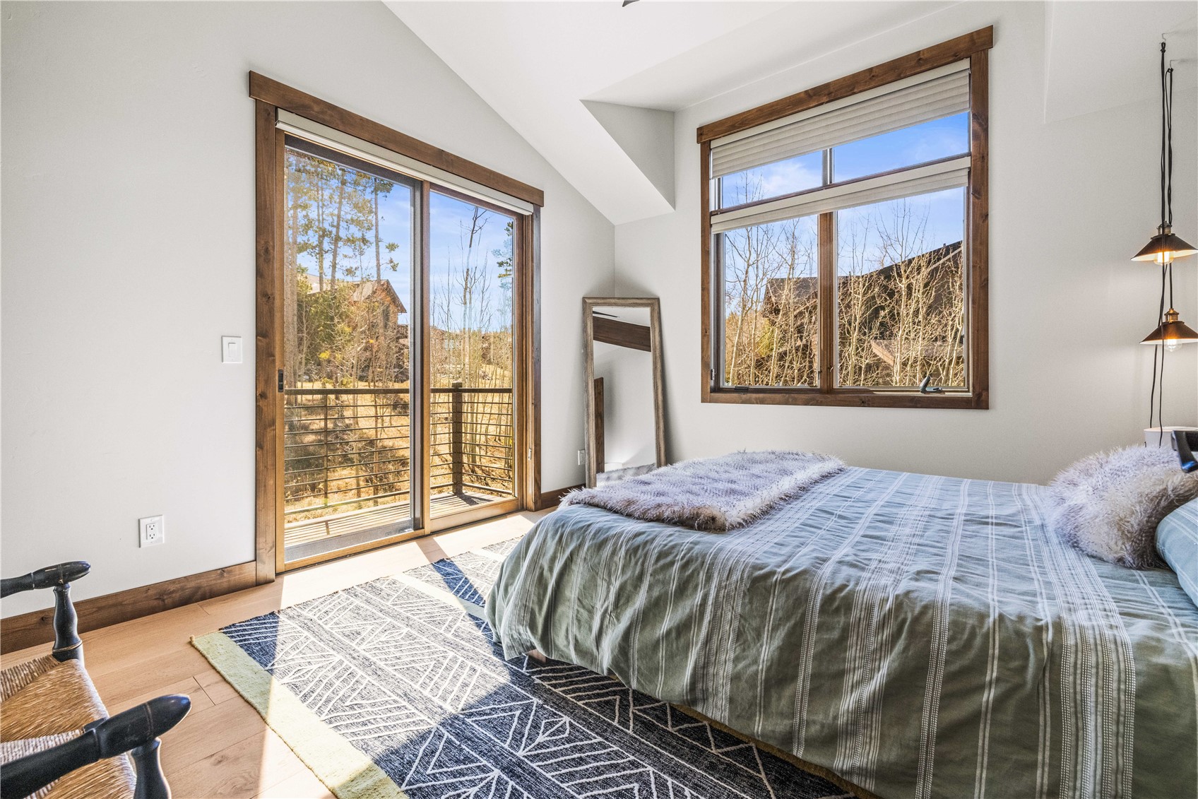 230 Game Trail Road Silverthorne, CO 80498 - Photo 39 of 43 a bedroom with a bed and a large window