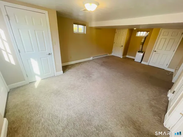 a view of an empty room with windows