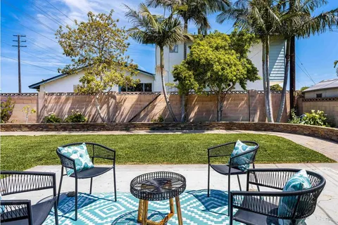 a view of a chairs and table in the patio