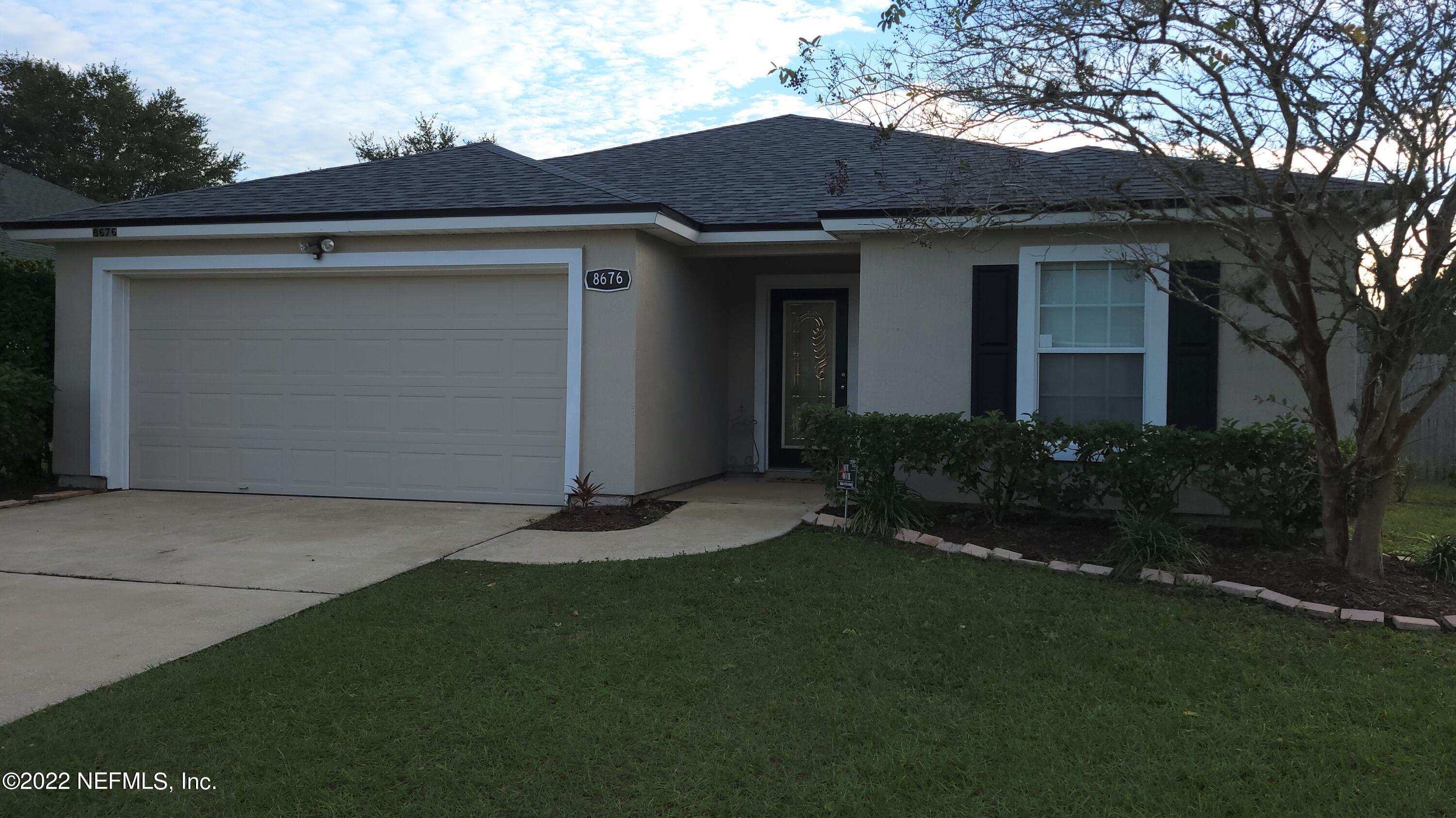 8676 Springtree Road Jacksonville, FL 32210 - Photo 1 of 15 Front