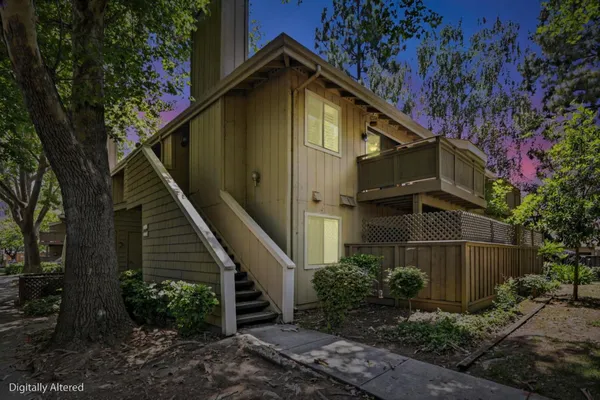 a front view of a house with trees