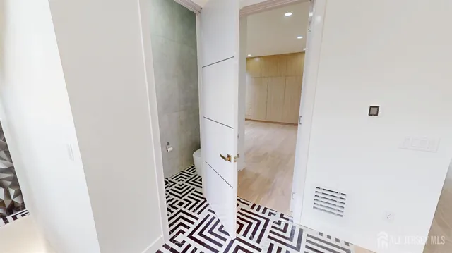 a very nice looking room with a big bed and a potted plant