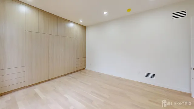 a bathroom with a sink and glass door
