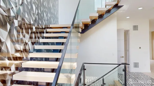 a view of a balcony with a floor to ceiling window with wooden floor