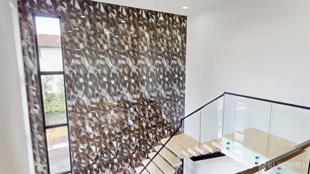 a view of an empty room with stairs