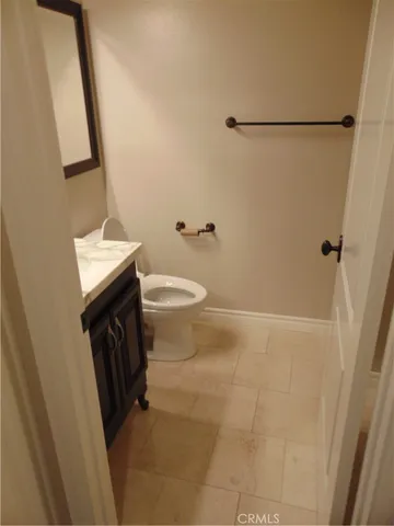 a bathroom with a sink a toilet a shower and a mirror