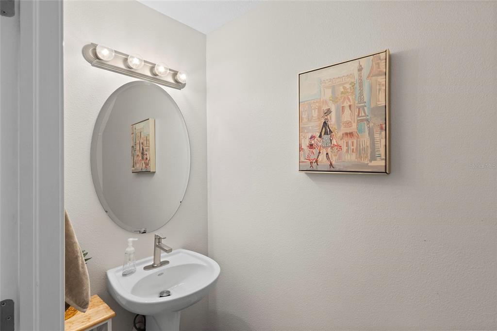 1461 Ridge Terrace Tarpon Springs, FL 34689 - Photo 11 of 25 a bathroom with a sink and mirror