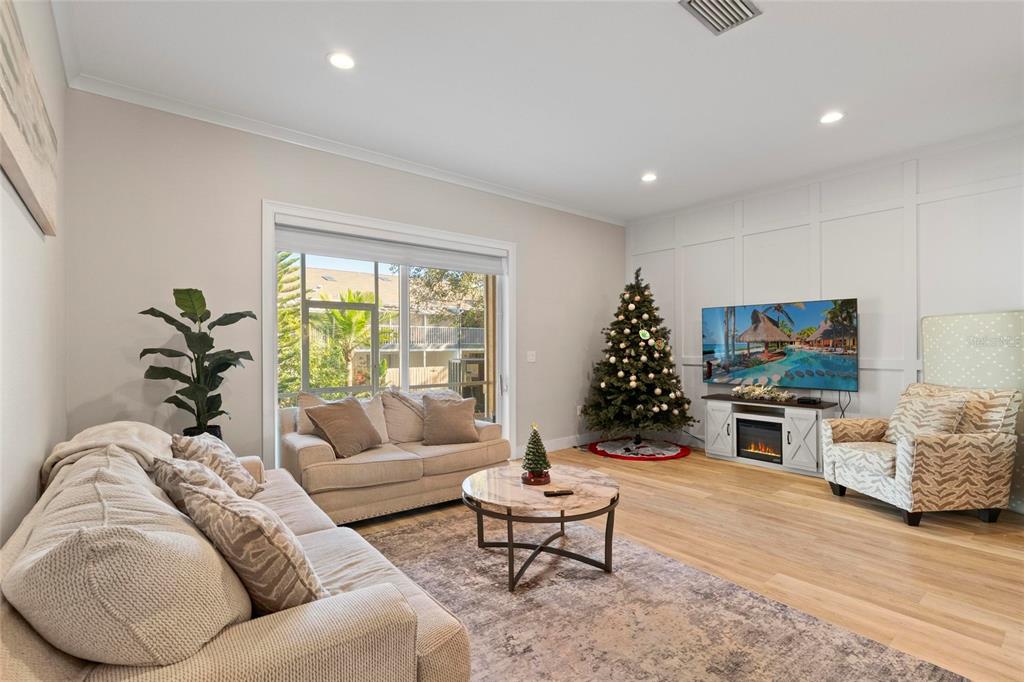 1461 Ridge Terrace Tarpon Springs, FL 34689 - Photo 13 of 25 a living room with furniture window and flat screen tv